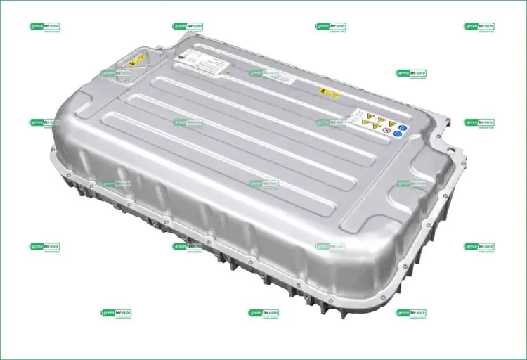 Large silver hybrid vehicle battery pack photographed at an angle with warning labels visible