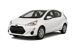 White Toyota hatchback seen from a three-quarter front angle, parked facing right.
