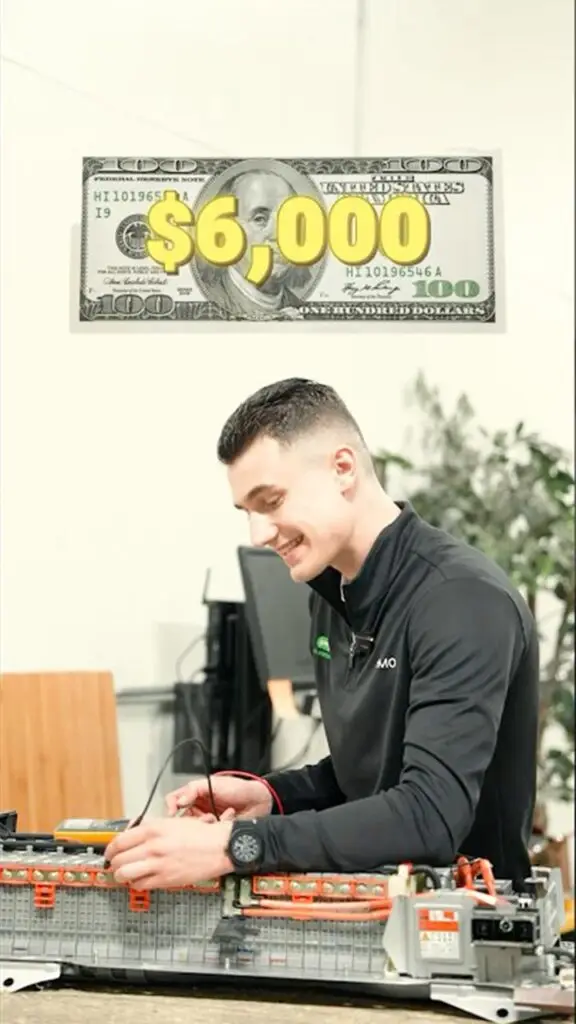 Man assembling electronics at a workstation with a bold '$6,000' prize graphic over a $100 bill above him.