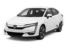 White Honda sedan, three-quarter front view from the left side.