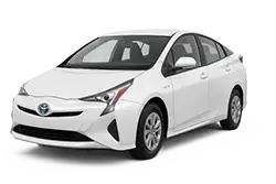 White compact sedan (Toyota) shown from front-right, highlighting the front and side profile.