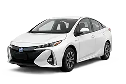 White Toyota sedan viewed from the front-left, showing the grille and headlights.