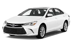 White Toyota sedan shown from a front-three-quarter angle, parked against a light background