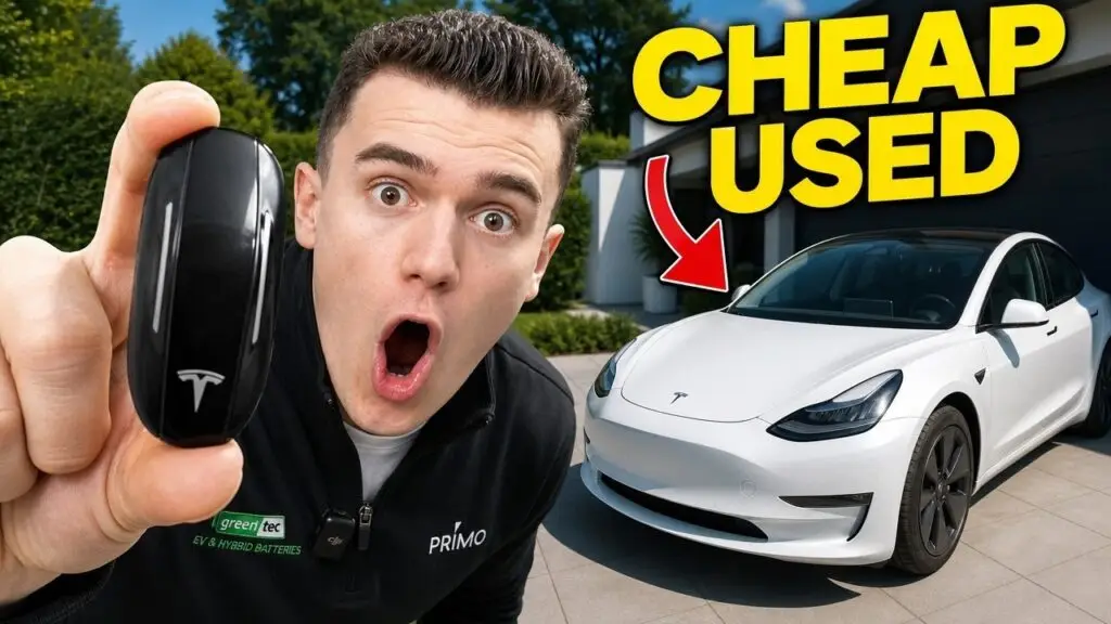 Man holds a Tesla key fob up to the camera beside a white Tesla in a driveway, with bold 'CHEAP USED' text overlay, suggesting a used-car video.